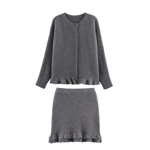 Women's dark gray knit two-piece set with button cardigan and ruffle hem skirt