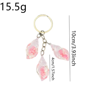Luminous glitter pink shell keychain with triple seashell pendants and 10cm size dimensions