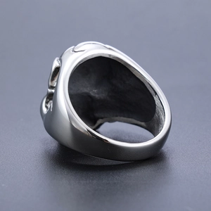 Polished silver stainless steel double skull punk ring with a wide band design for men