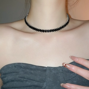 Close-up of black marquise-cut zircon choker necklace with silver-tone metal settings