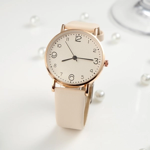 Women's quartz watch with rose gold case, cream dial and beige leather strap on white surface