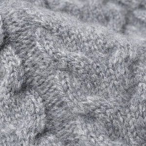 Winter grey cable knit beanie wool hat with fluffy pompom soft warm texture