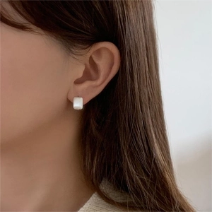Minimalist square pearl stud earrings in 925 sterling silver worn by female model