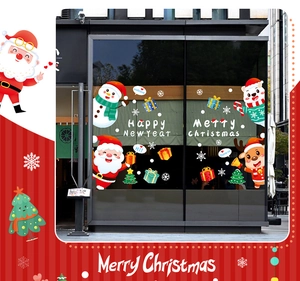 Christmas window decals showing Santa and reindeer stickers on shop glass display