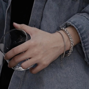 Silver stainless steel chain bracelets set for men worn with denim jacket and glass