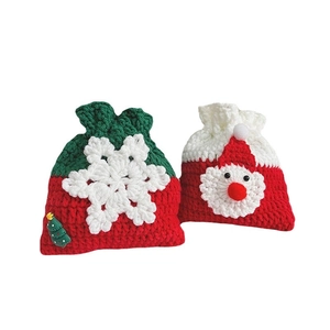 Handmade crochet Christmas gift bags featuring Santa Claus and snowflake drawstring patterns