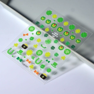 St. Patrick's Day nail art stickers featuring shamrocks and gold coins on green sheets