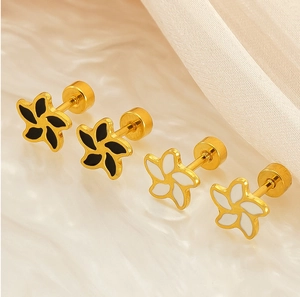 Macro view of gold flower earrings with enamel petals and secure screw-back design