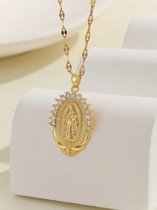 Close-up of Virgin Mary pendant with gold plating and colorful zircon stones