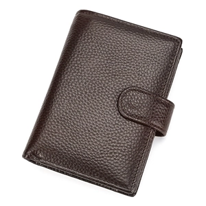 Detailed view of dark brown genuine leather trifold wallet with pebble grain texture