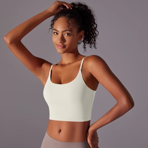 Detail view of cream white high-impact sports bra with thin straps and U-neckline