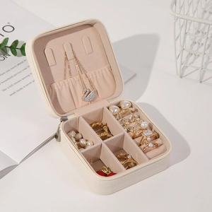 Portable square leather jewelry box with zipper and velvet interior for travel storage