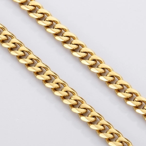 Close-up of polished gold-plated stainless steel Cuban link chain with interlocking rings