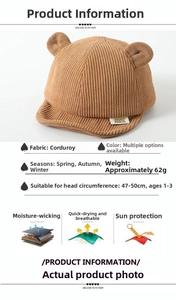 Brown corduroy baby cap with bear ears detail showing size and material specifications