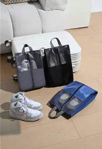 Three travel shoe bags in grey black and blue with mesh windows for easy identification