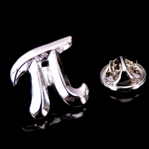 Macro view of a silver pi symbol lapel pin with a metal butterfly clutch on black background