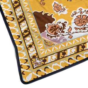 Bohemian style flannel blanket in ginger yellow featuring ethnic floral patterns