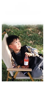 Detail of waterproof black kids apron vest for painting and crafts with stain-resistant fabric