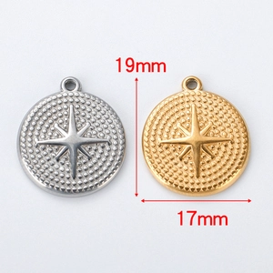 Detailed view of 17mm gold and silver star etched pendants with size measurements