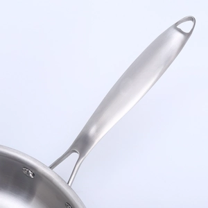 Close-up of double-riveted stainless steel handle on 3-layer induction frying pan