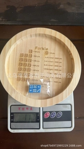 Farkle dice tray weight measurement showing the product scale reading of 117 grams