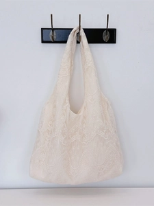 Elegant off-white lace shoulder tote bag with floral pattern for casual shopping