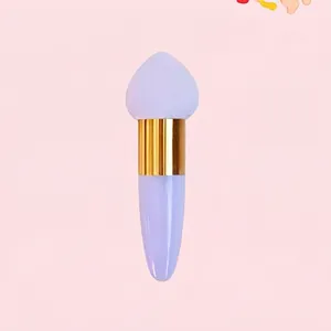 Detail of lavender makeup sponge brush with golden metal tube and teardrop tip