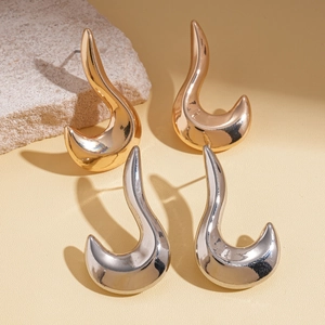 Irregular geometric metallic stud earrings set in gold and silver mirror finish