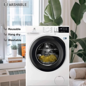 Close-up of washable reusable bag attributes on washing machine with hang dry text