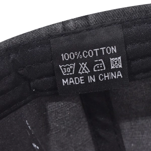Detail shot of the 100% cotton material label and inner stitching on the baseball cap