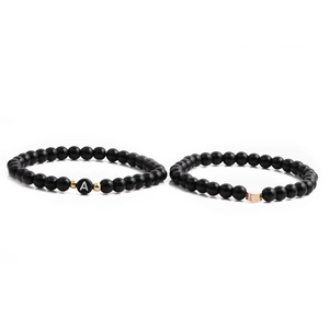 6mm matte black bead bracelet set with golden heart charm and white letter A bead