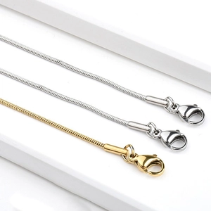 Set of gold and silver round snake bone necklaces in durable stainless steel finish