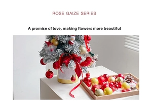 Detailed set of Christmas baubles in matte and glossy red and gold with ribbon and doll