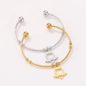 Minimalist titanium steel open bangles set in gold and silver with winged heart charms