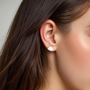 Elegant S925 sterling silver fan-shaped stud earrings featuring a textured seashell design