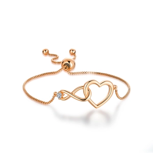 Detail of rose gold infinity heart bracelet with cubic zirconia and adjustable clasp