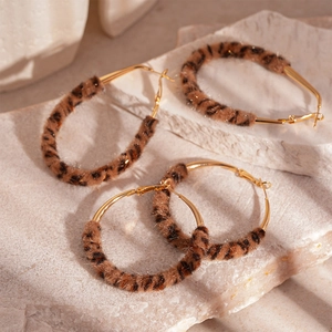 Chic leopard print plush earrings in gold circle and oval shapes for winter fashion