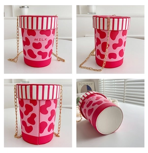 Detailed views of a pink cow print bucket bag with gold chain and MILK text design