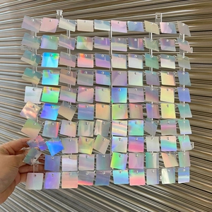 Close-up of square sequin shimmer wall panel with iridescent laser finish for party decor