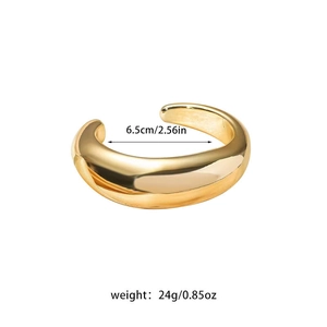 Close-up of golden open bangle with 6.5cm inner diameter and 24g weight measurement