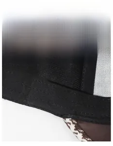 Detail of the houndstooth baseball cap featuring a wide moisture-wicking sweatband inside