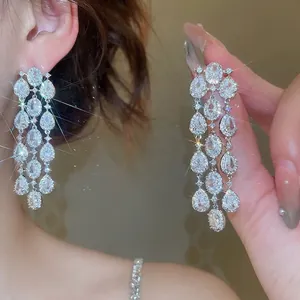 Sparkling silver fringe earrings with pear-shaped zircon stones in a floral tassel design