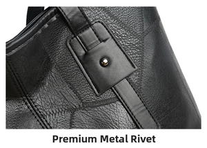 Detail of silver rivets and litchi grain leather on a black tote bag strap