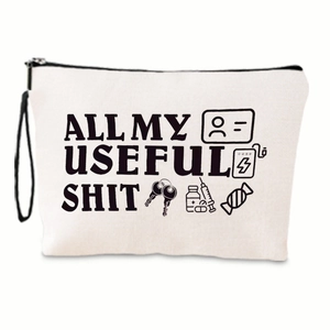 Detail of canvas makeup bag featuring black zipper and humorous graphic print