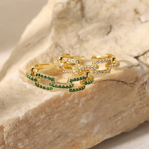 18K gold plated chain link rings with green and white cubic zirconia on stone base
