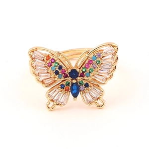 Macro view of gold butterfly ring with colorful cubic zirconia and marquise stones