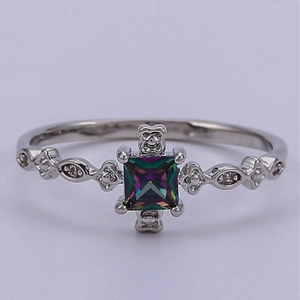 Exquisite silver ring with a square iridescent topaz and sparkling side stones