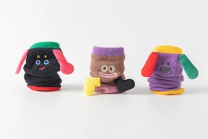 Detailed view of three cute cartoon animal thermal socks in black, brown, and purple