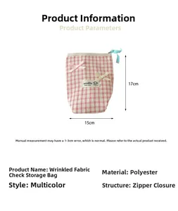 Polyester checkered makeup bag with bows, 17cm by 15cm size guide and zipper detail