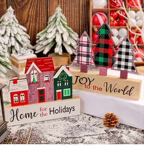 Detailed view of wood Christmas house decor with Home for the Holidays text and snow scene
